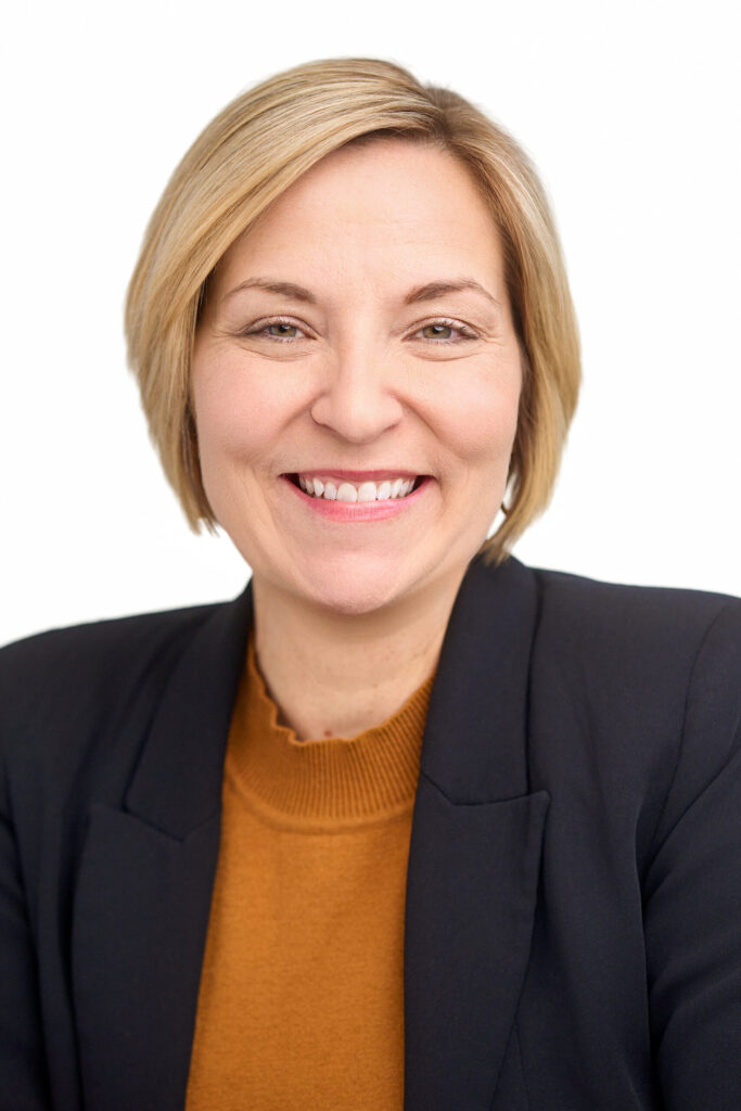 Theresa Lapensee, founder of ResidentOps Studio, smiling in a professional portrait.